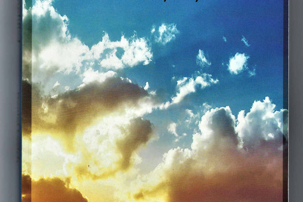 Book cover with a vibrant sky and clouds at sunrise or sunset.